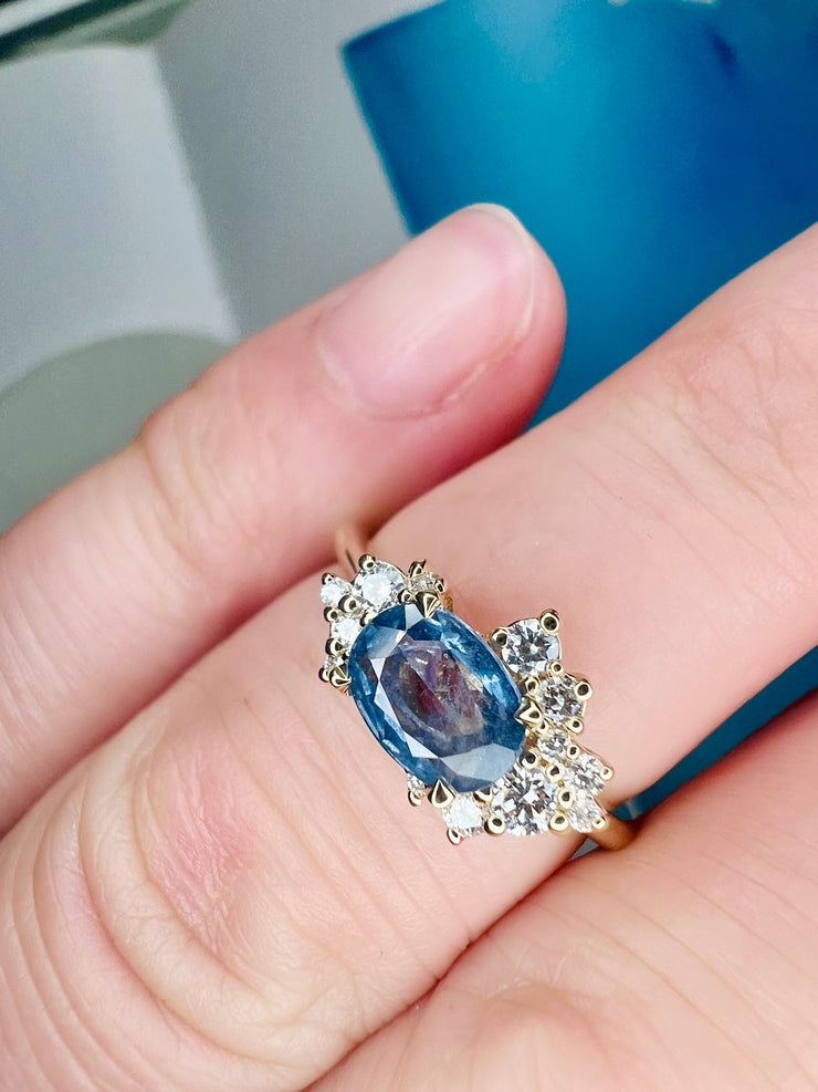 Astra Natural Blue Sapphire Asymmetrical Cluster Engagement Ring Success Shown On A Hand